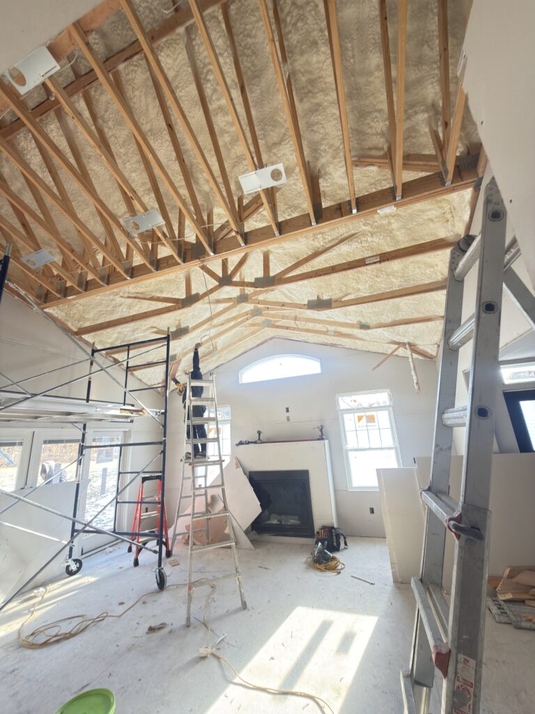 Vaulted ceiling spray foam insulation installation - Action Construction
