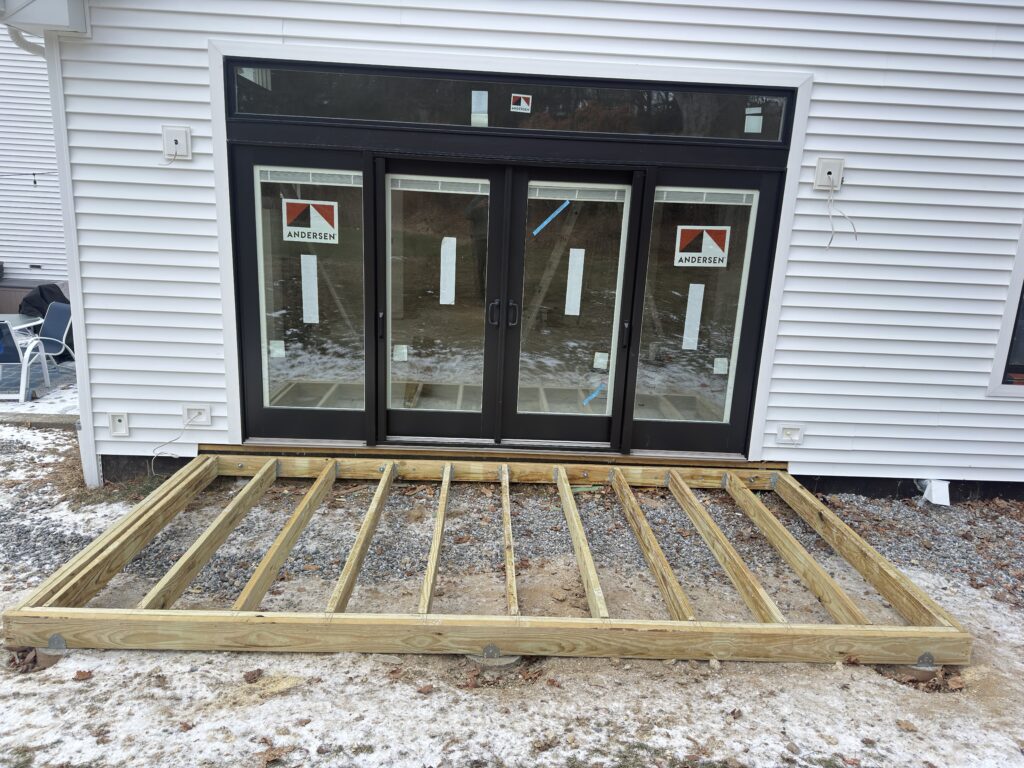 Completed home addition exterior with new siding and windows - Action Construction