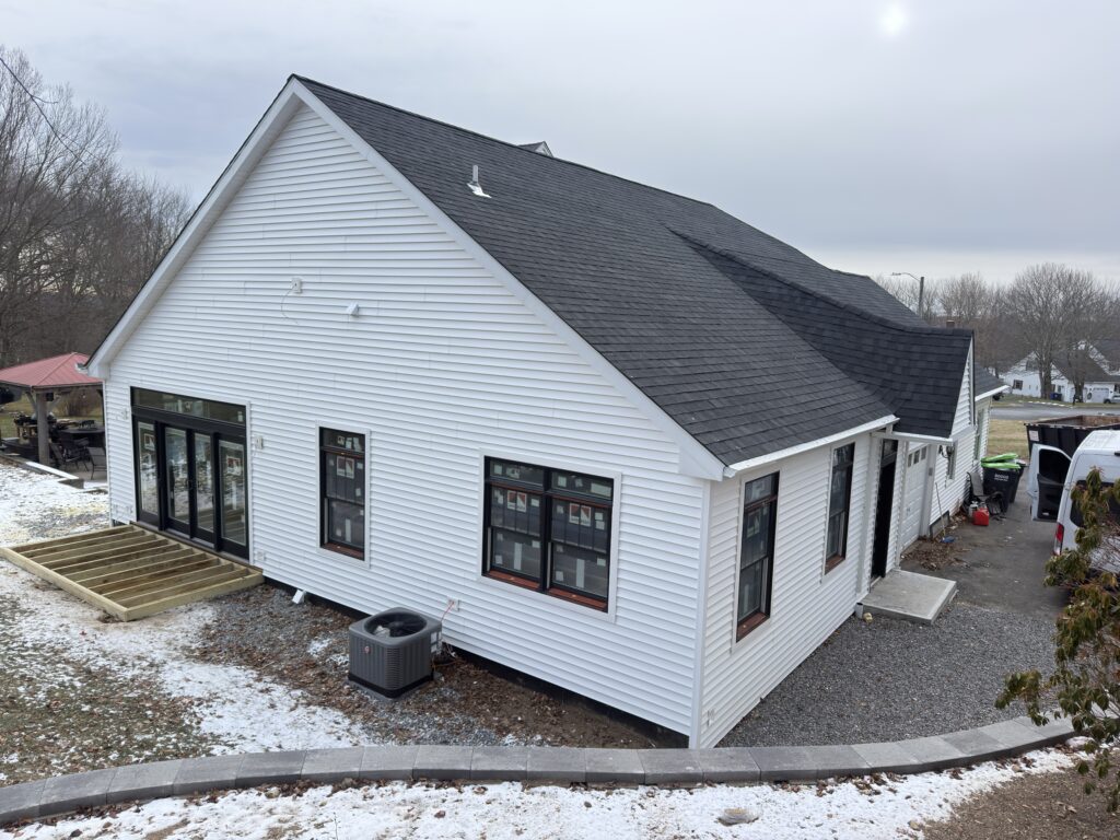 Finished home addition roofline and siding detail - Action Construction