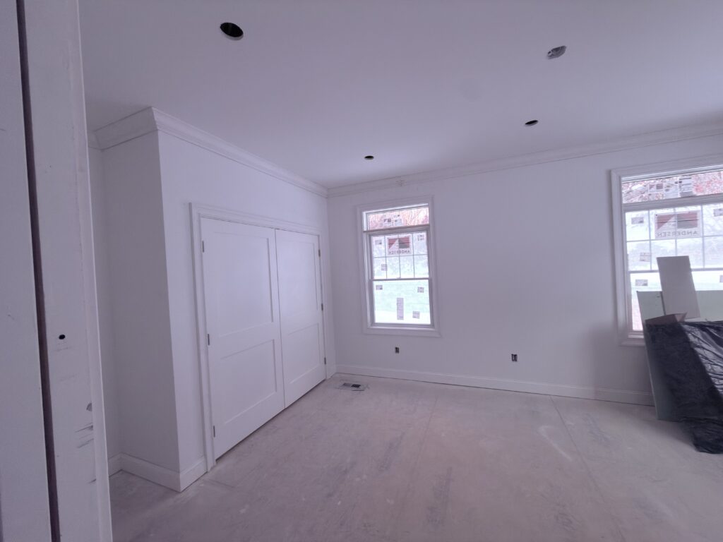 Finished bedroom remodel with custom trim - Action Construction