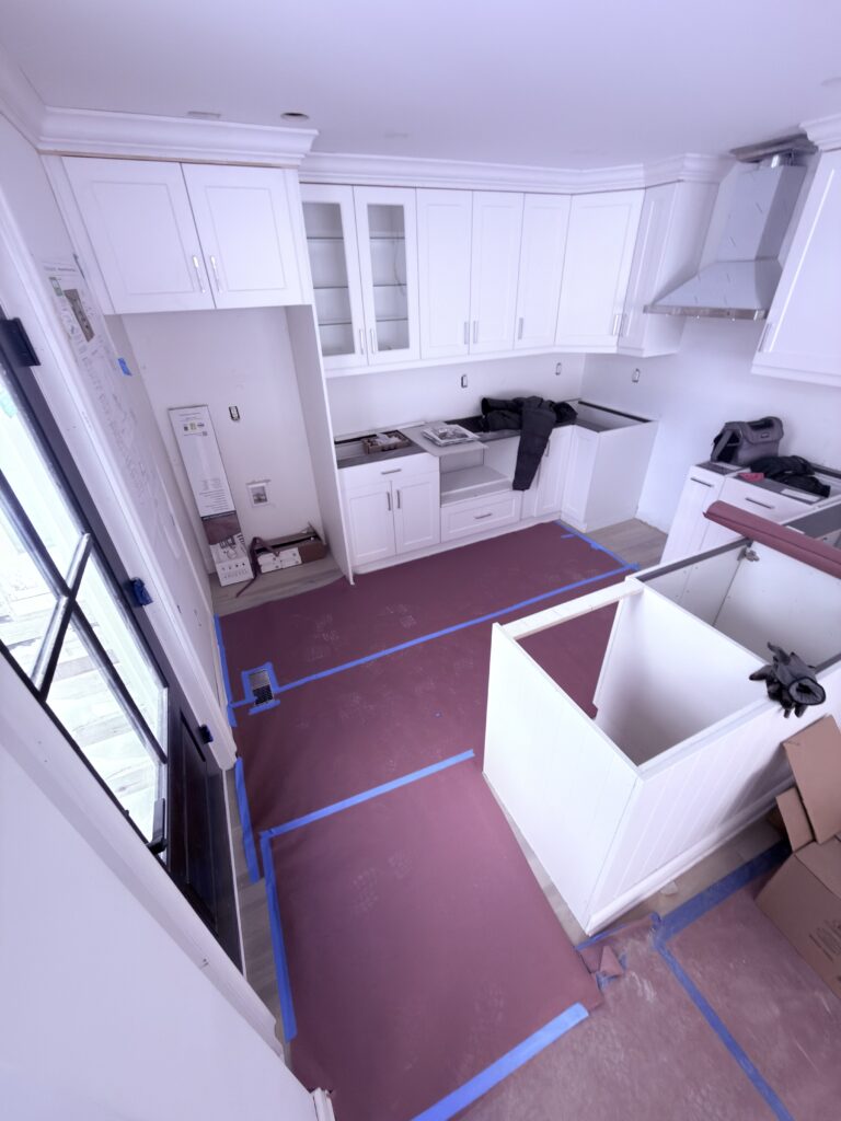 Completed kitchen remodel with island - Action Construction